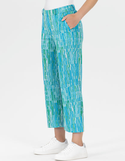 wide leg pull on culotte trouser with elasticated was it and side pockets featuring a unique abstract print in blues and turquoise and green