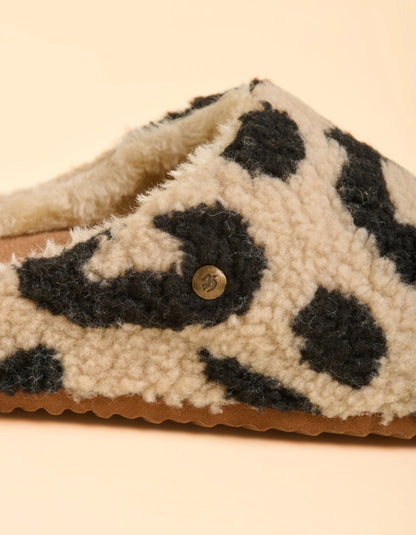 Close-up of a slipper with leopard print pattern on a beige background