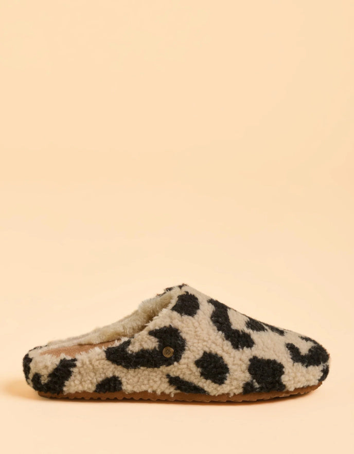 Leopard print slipper on a beige background