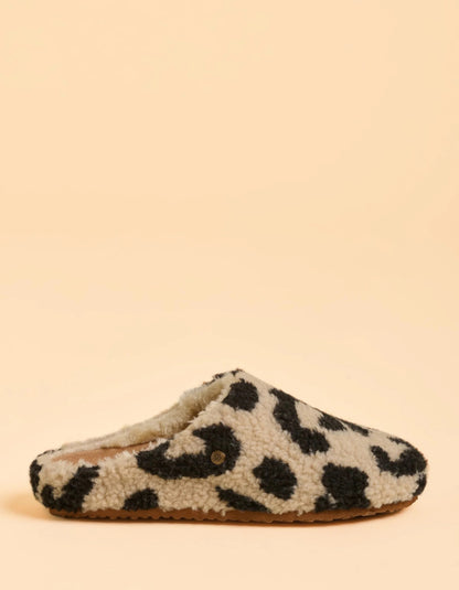Leopard print slipper on a beige background
