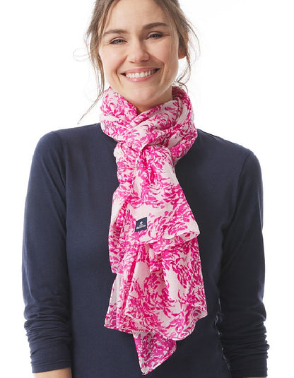 Woman wearing a pink floral scarf on a white background