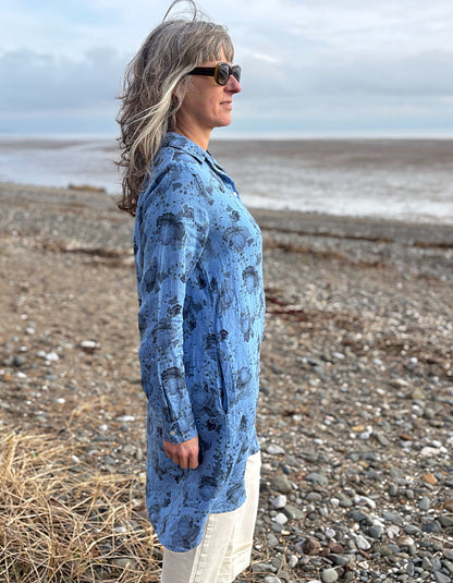 woman wearing a blue floral linen shirt dress