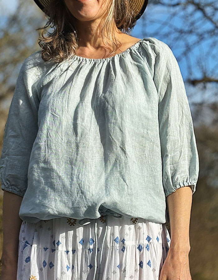 pale blue linen top with elasticated neckline so you can wear on or off the shoulder