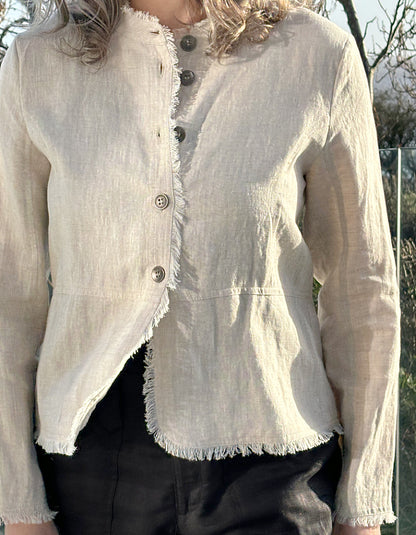 beige linen cropped summer jacket with shaped waistline and pleated peplum shaping at the back with frayed edges