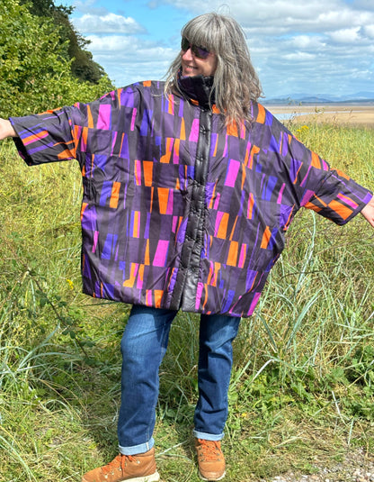 reversible oversized lightweight coat in black and purple and orange print