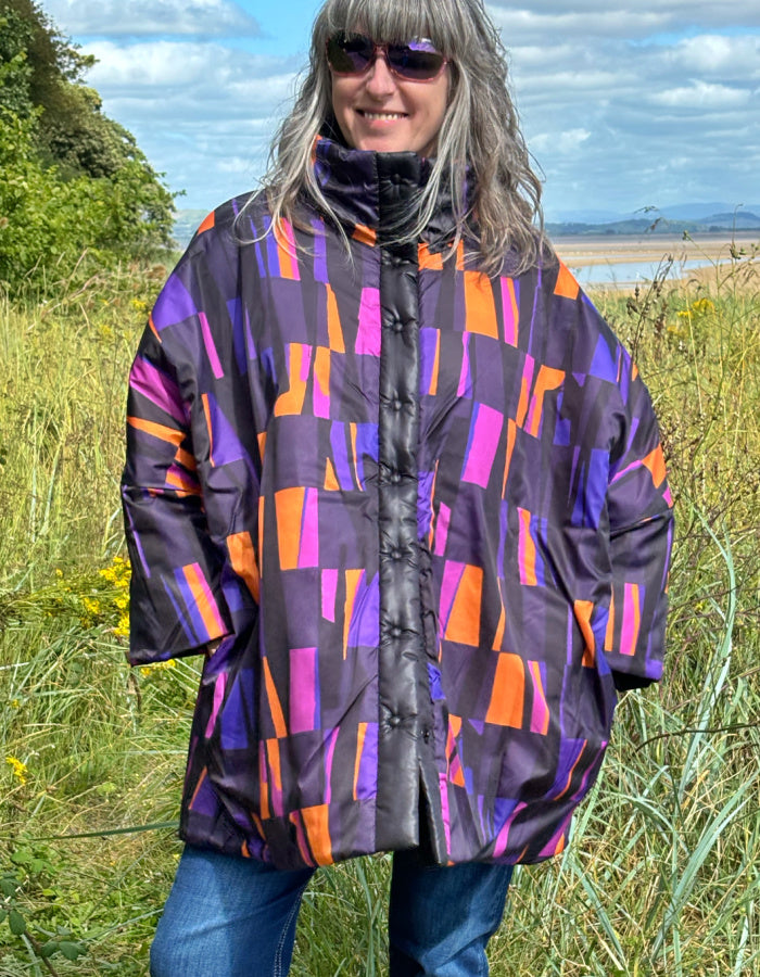 reversible oversized lightweight coat in black and purple and orange print