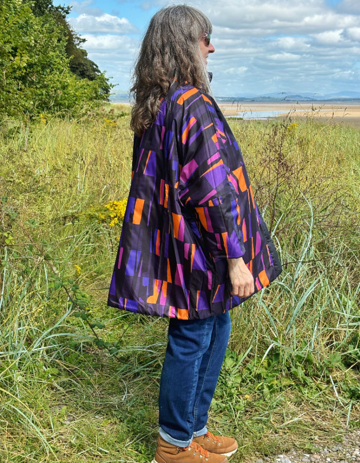 reversible oversized lightweight coat in black and purple and orange print