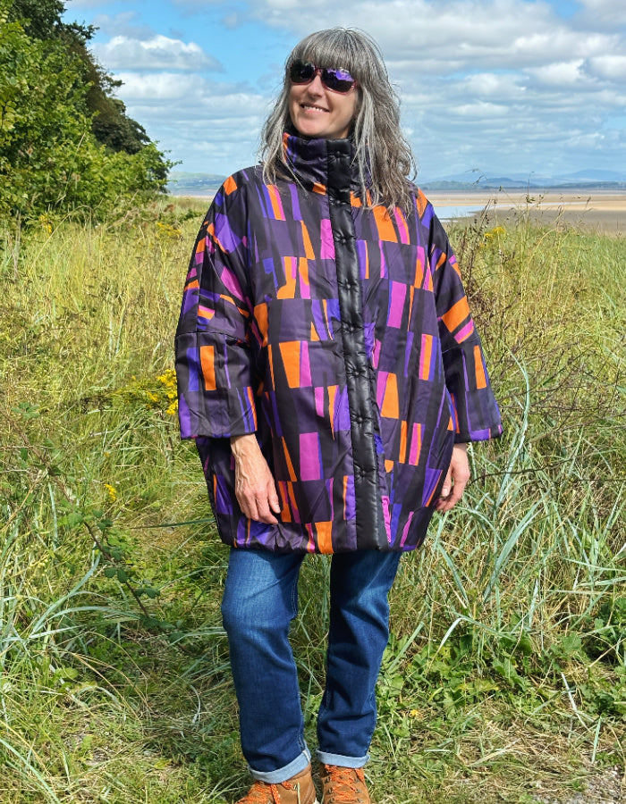 reversible oversized lightweight coat in black and purple and orange print