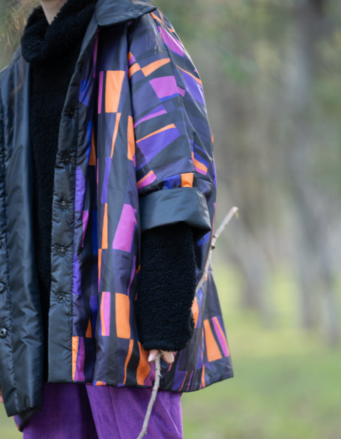 reversible oversized lightweight coat in black and purple and orange print