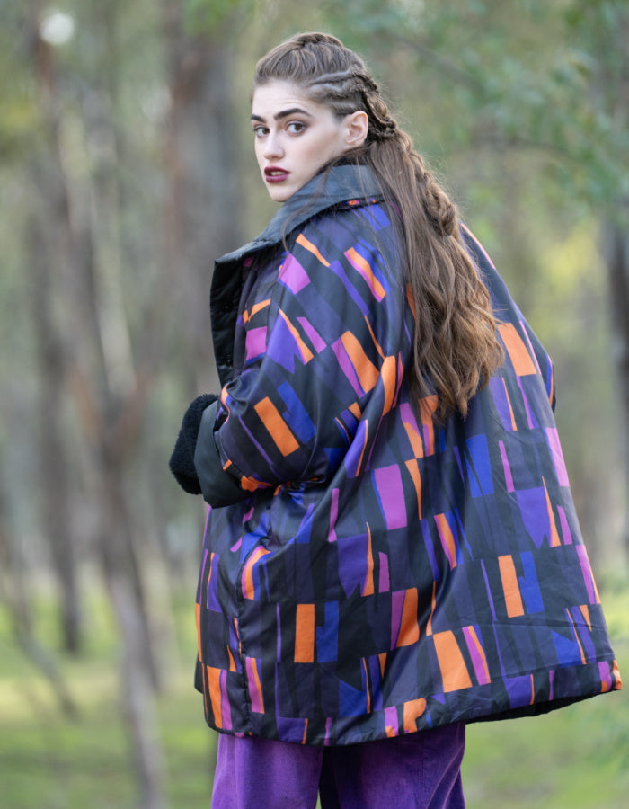 reversible oversized lightweight coat in black and purple and orange print