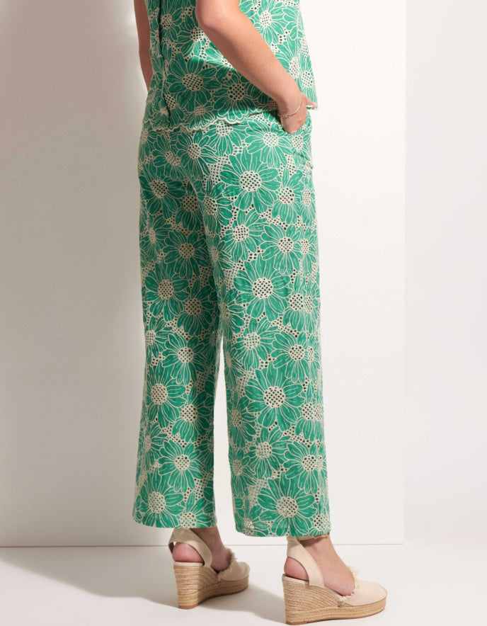woman wearing green lace floral top and trousers set