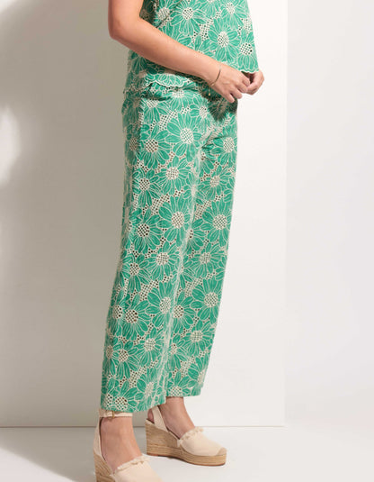woman wearing green lace floral top and trousers set