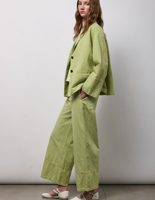 woman wearing pesto green linen jacket
