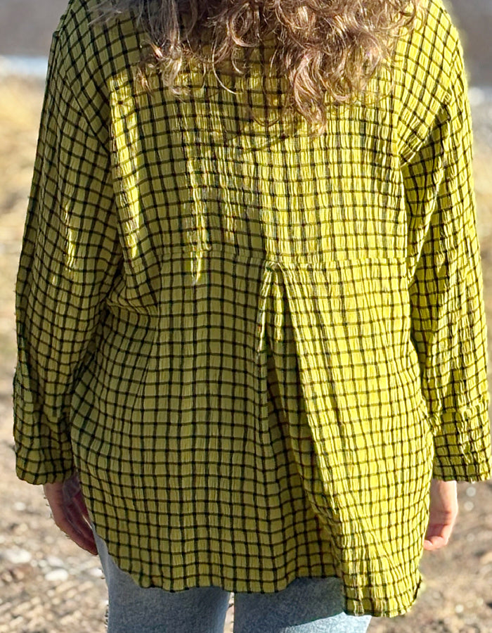 ochre green viscose swing shirt with black check print. box pleat at the back