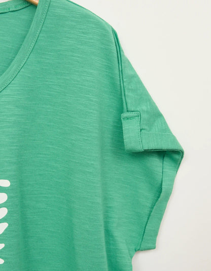 green cotton short sleeve t shirt with white leaf motif print