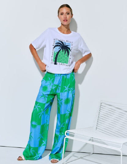 silky palazzo trousers with elasticated waist and wide leg in green and blue palm tree print