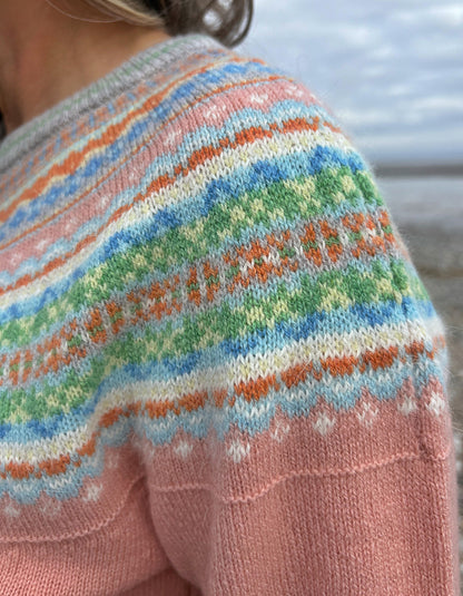 woman wearing peach fair isle cardigan