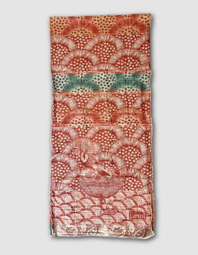 Patterned jacquard organic cotton scarf with star designs in terracotta, green and cream