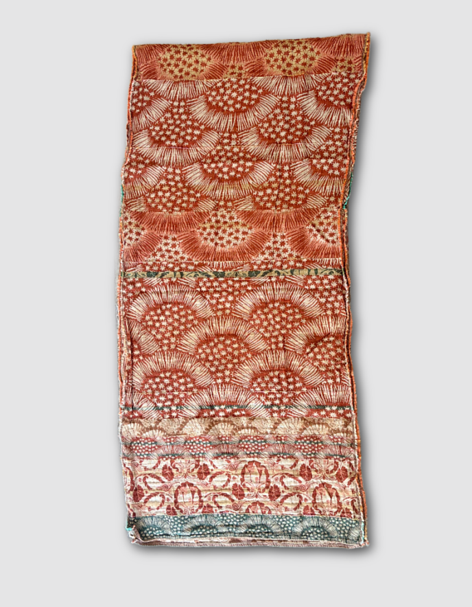 Patterned jacquard organic cotton scarf with star designs in terracotta, green and cream