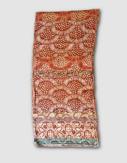Patterned jacquard organic cotton scarf with star designs in terracotta, green and cream