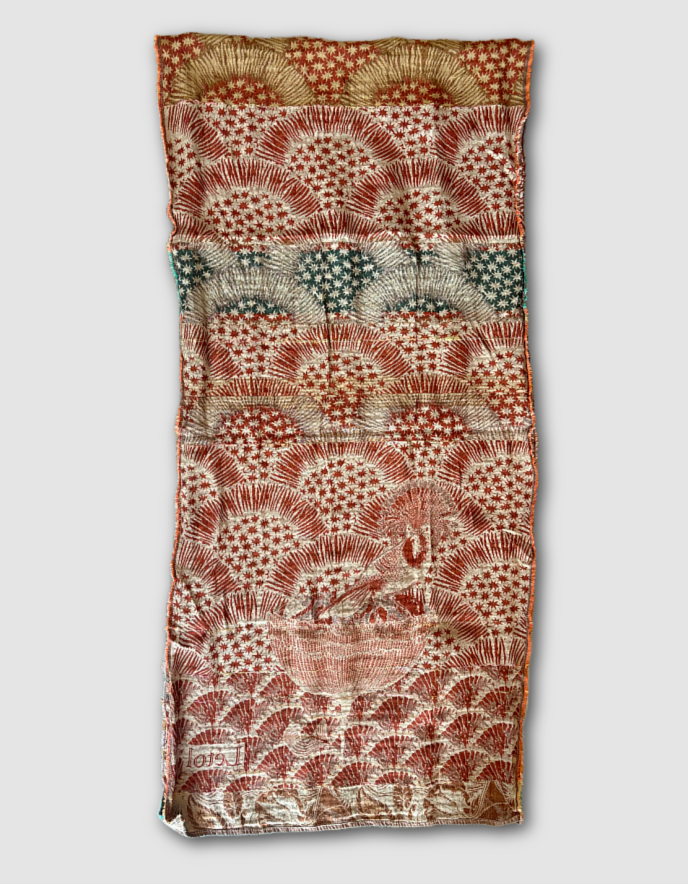 Patterned jacquard organic cotton scarf with star designs in terracotta, green and cream