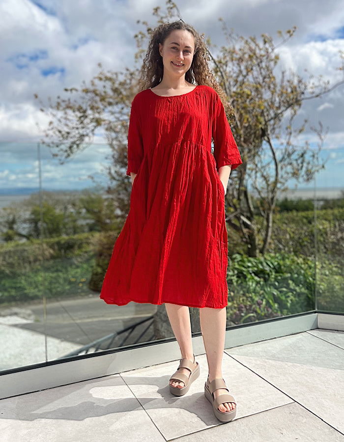 red cotton swing dress, loose fit, knee length with elbow length sleeves