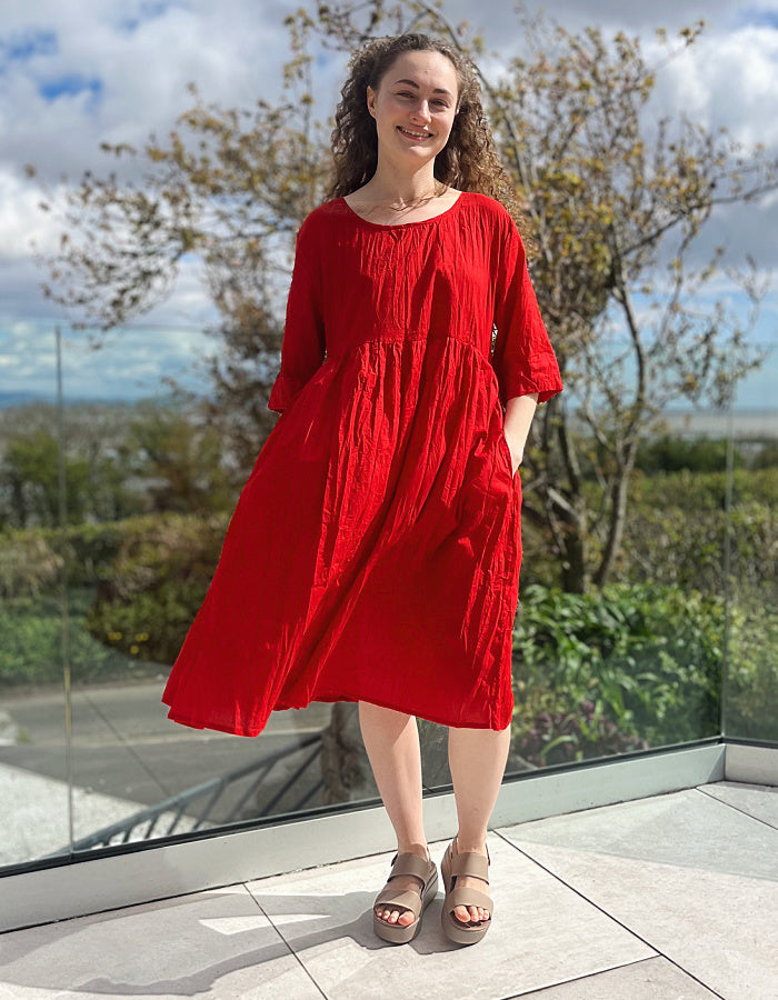 red cotton swing dress, loose fit, knee length with elbow length sleeves