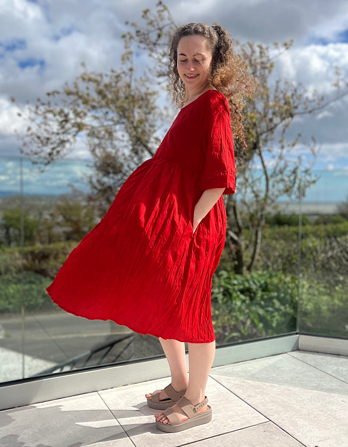 red cotton swing dress, loose fit, knee length with elbow length sleeves