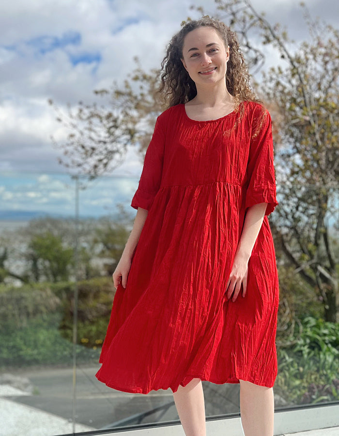 red cotton swing dress, loose fit, knee length with elbow length sleeves