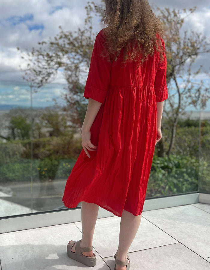 red cotton swing dress, loose fit, knee length with elbow length sleeves