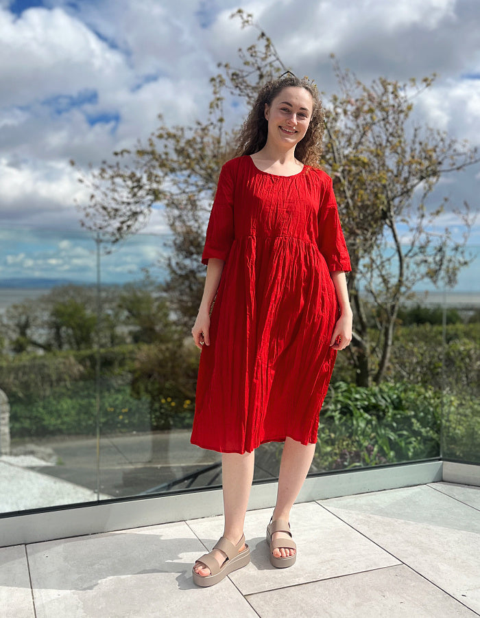 red cotton swing dress, loose fit, knee length with elbow length sleeves