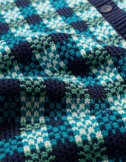 Close-up of a knitted fabric with a blue and green pattern