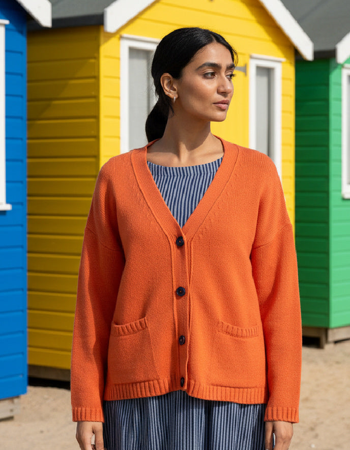 woman wearing orange boyfriend wool cardigan