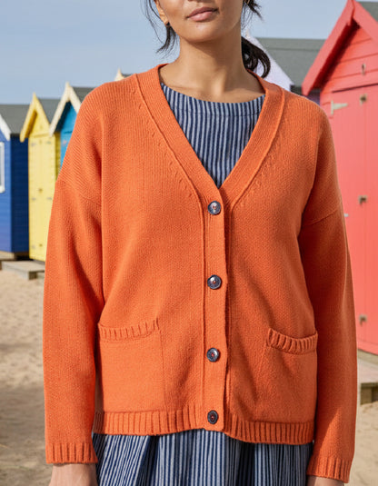 woman wearing orange boyfriend wool cardigan
