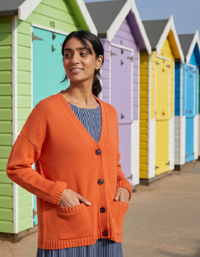 woman wearing orange boyfriend wool cardigan