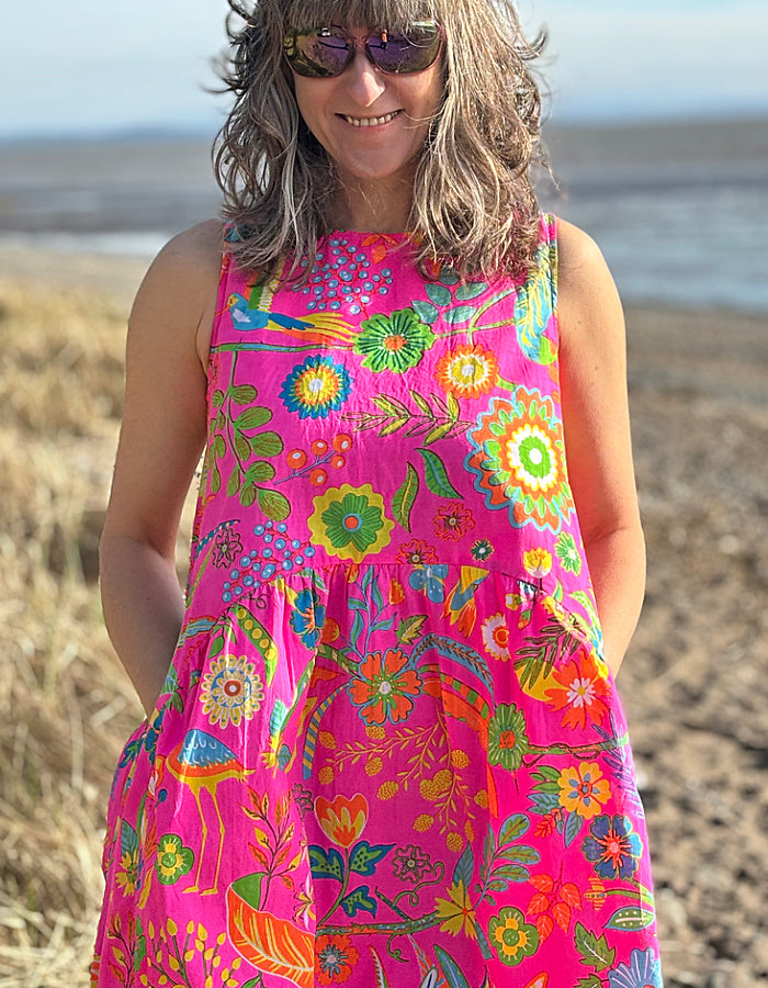 neon pink sleeveless cotton bubble dress with tropical fruit print, includes pockets