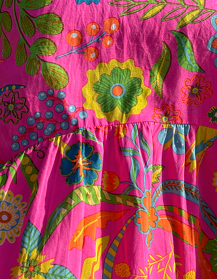 neon pink sleeveless cotton bubble dress with tropical fruit print, includes pockets