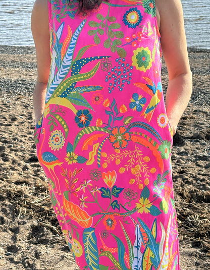 sleeveless neon pink shift dress with bright exotic fruit print and with pockets