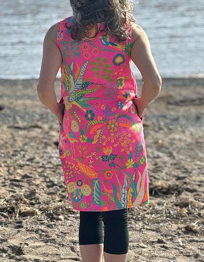 sleeveless neon pink shift dress with bright exotic fruit print and with pockets