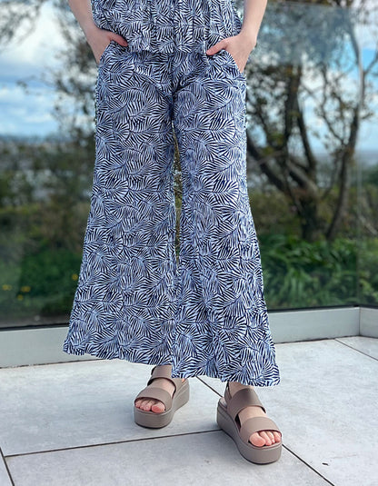 wide leg cotton crinkle trousers with elasticated waist and blue and white leaf print