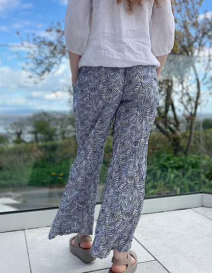 wide leg cotton crinkle trousers with elasticated waist and blue and white leaf print