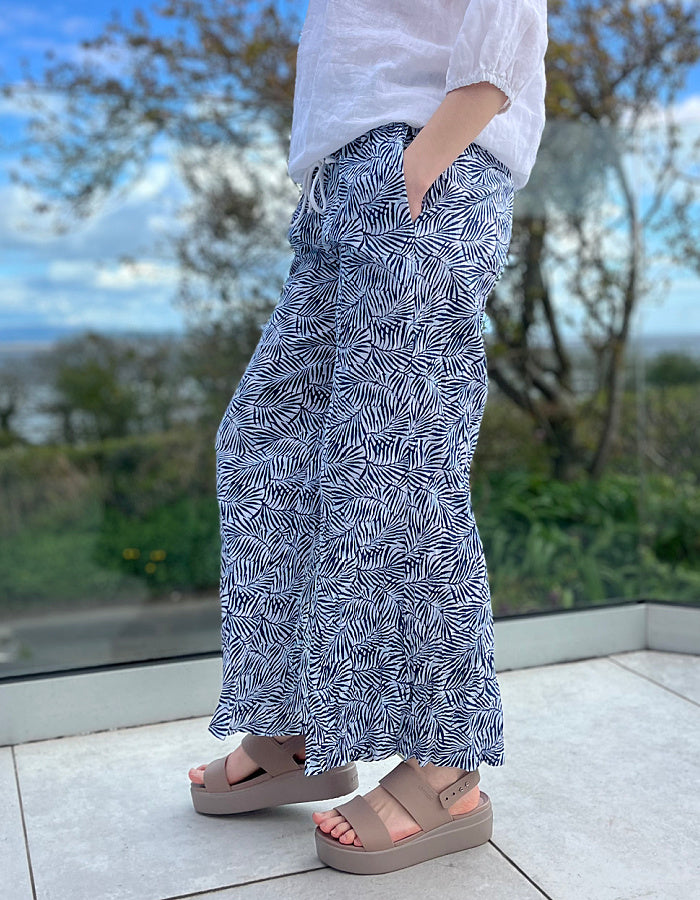 wide leg cotton crinkle trousers with elasticated waist and blue and white leaf print