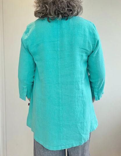 aquamarine linen tunic shirt with 1 button at the neckline and front pleat