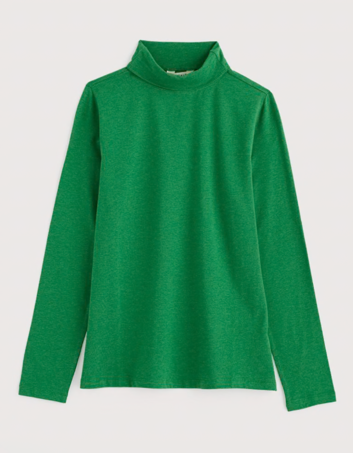Green turtleneck sweater on a light gray background