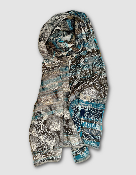 jacquard reversible scarf made from organic cotton in blue and brown tones with hedgehog print