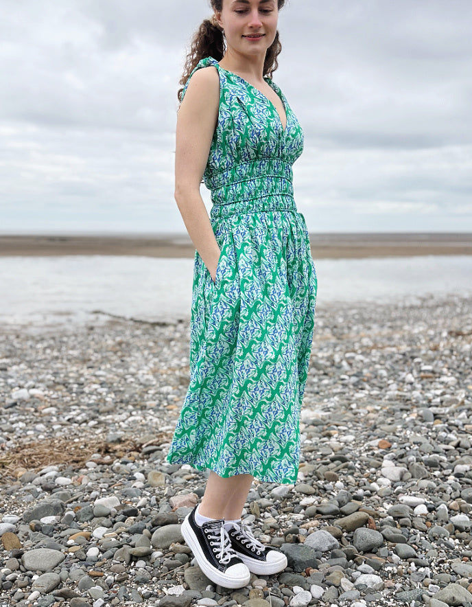 green floral sleeveless fit and flare cotton midi dress