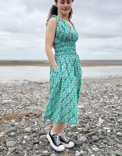 green floral sleeveless fit and flare cotton midi dress