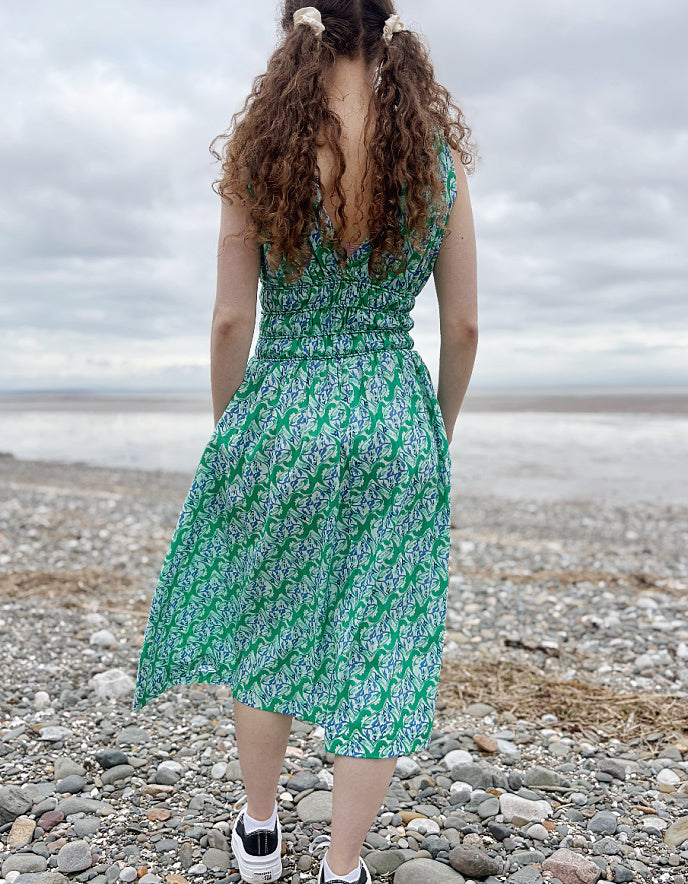 green floral sleeveless fit and flare cotton midi dress