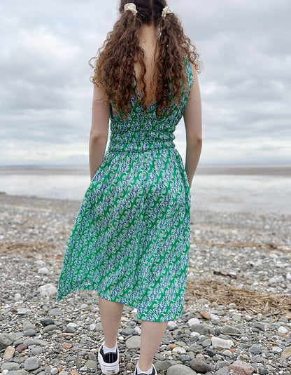 green floral sleeveless fit and flare cotton midi dress