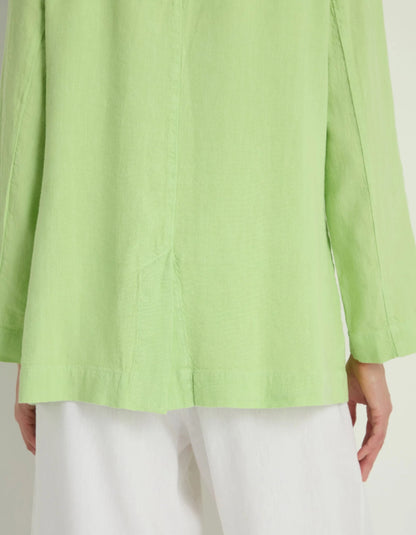 Light green jacket worn by a person on a white background